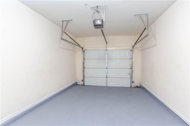 529 Ridge View Xing, Woodstock, GA 30188 - garage with a garage door opener and baseboards