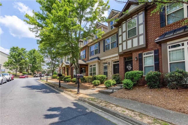 529 Ridge View Xing, Woodstock, GA 30188 - view of asphalt road featuring curbs, sidewalks, and a residential view