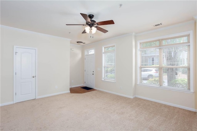 529 Ridge View Xing, Woodstock, GA 30188 - entryway featuring carpet flooring, ornamental molding, a ceiling fan, and baseboards