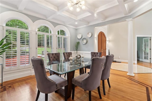 1213 Grande Vw, Loganville, GA 30052 - dining area featuring coffered ceiling, beamed ceiling, decorative columns, light wood-style flooring, and a chandelier