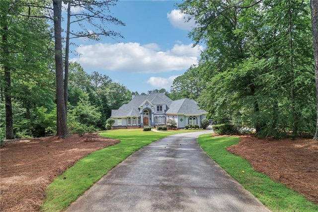1213 Grande Vw, Loganville, GA 30052 - view of front of house featuring driveway and a front yard