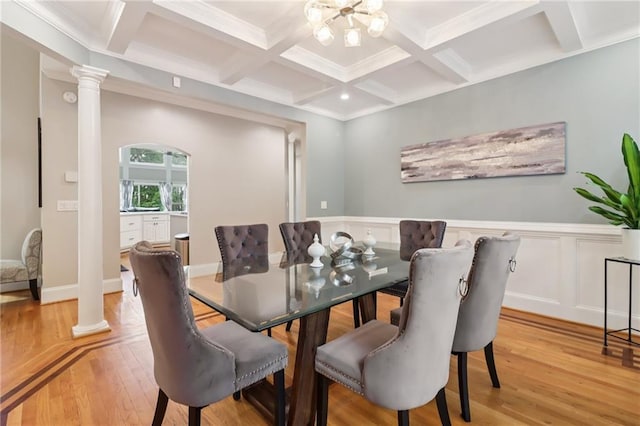 1213 Grande Vw, Loganville, GA 30052 - dining area featuring light wood-style flooring, ornate columns, beam ceiling, coffered ceiling, and wainscoting