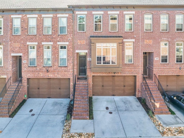 townhome / multi-family property featuring a garage