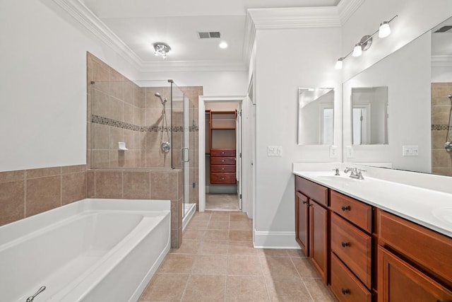 bathroom featuring vanity, crown molding, tile patterned floors, and plus walk in shower