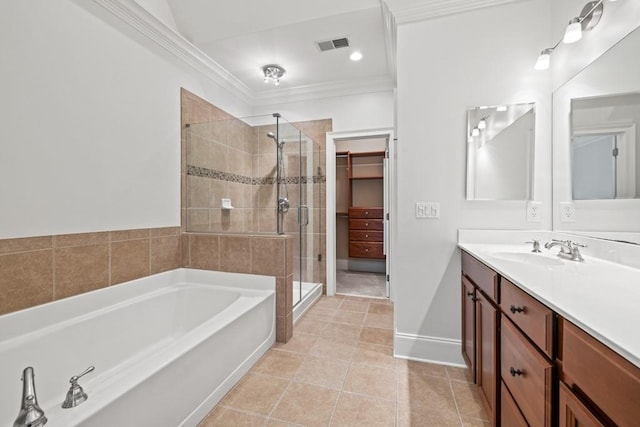 bathroom with vanity, ornamental molding, tile patterned floors, and plus walk in shower