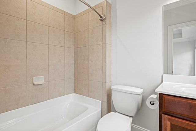 full bathroom featuring tiled shower / bath, vanity, and toilet