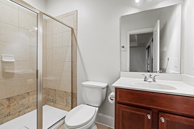 bathroom featuring vanity, toilet, and walk in shower