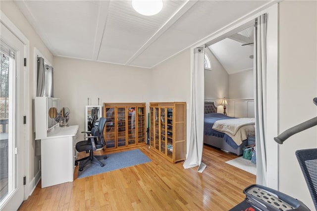 office space with hardwood / wood-style floors and lofted ceiling