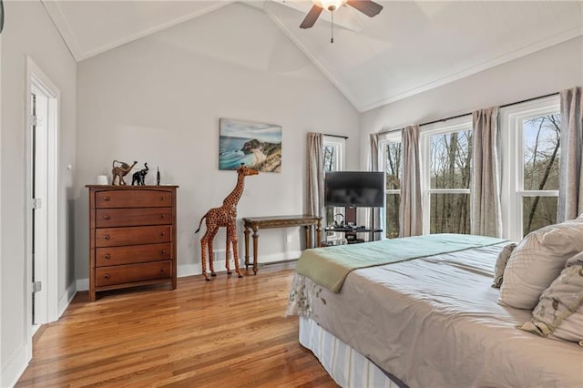 bedroom with ceiling fan, high vaulted ceiling, and light wood-type flooring