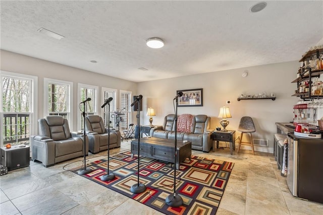 living room with a textured ceiling