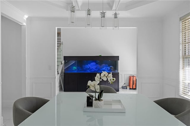 dining space with beam ceiling and crown molding