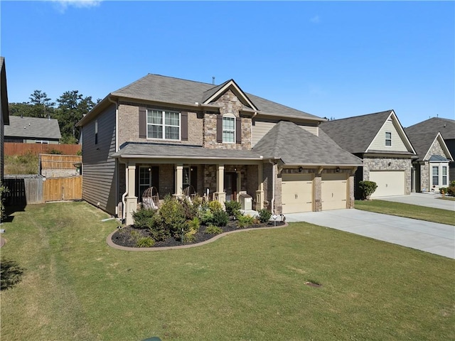 craftsman house featuring a front lawn, a garage, and a porch