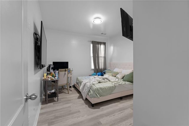 bedroom with light wood-type flooring