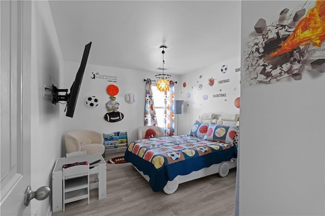 bedroom featuring wood-type flooring