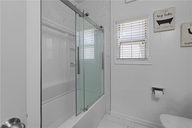 bathroom with toilet and enclosed tub / shower combo