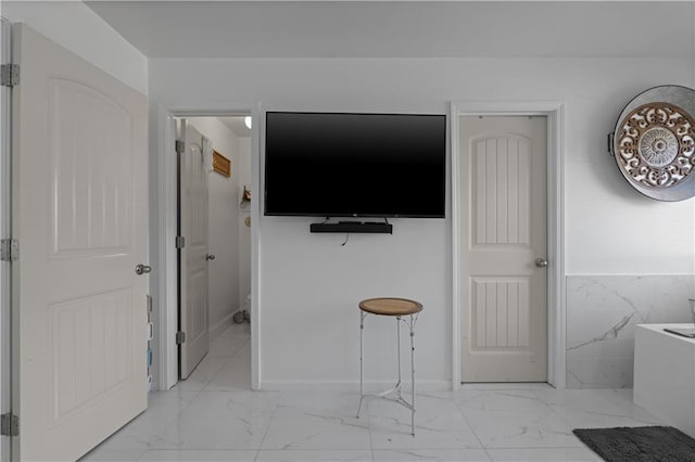 bedroom with tile walls