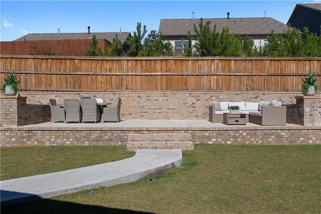 view of yard with an outdoor living space and a patio area