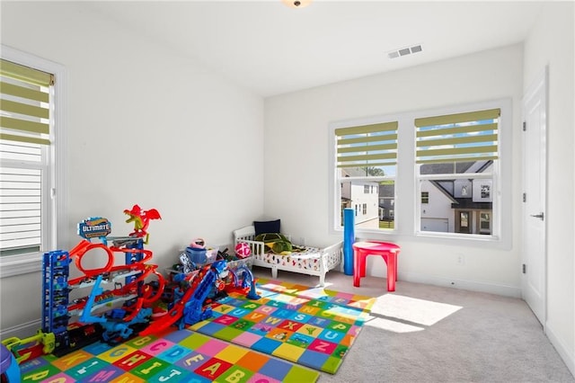 game room featuring visible vents and carpet