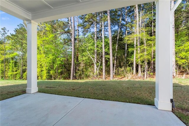 view of patio with a view of trees