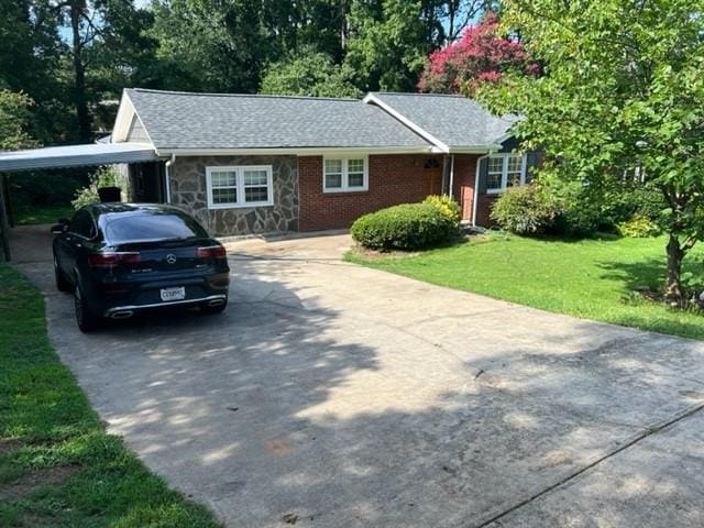 single story home with a carport and a front lawn