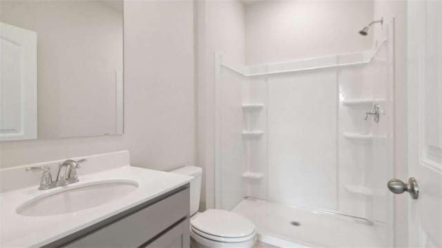 204 College Cir Unit 1003, Hapeville, GA 30354 - bathroom featuring vanity, toilet, and a shower