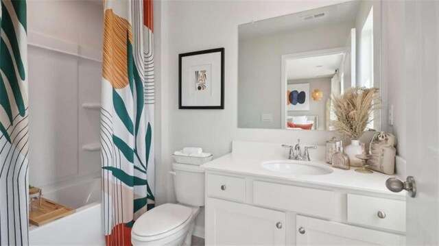 204 College Cir Unit 1003, Hapeville, GA 30354 - full bathroom featuring vanity, toilet, and shower / bath combo with shower curtain