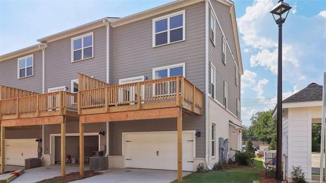 204 College Cir Unit 1003, Hapeville, GA 30354 - rear view of house featuring a garage, a deck, and central air condition unit
