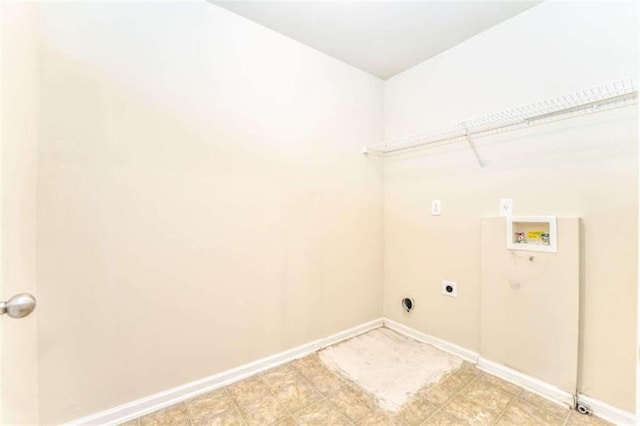 washroom featuring light floors, baseboards, hookup for an electric dryer, hookup for a washing machine, and laundry area