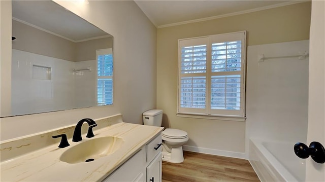 full bath with baseboards, toilet, wood finished floors, crown molding, and vanity