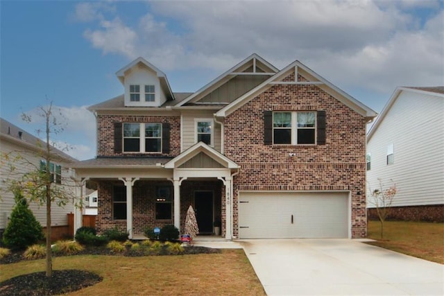 craftsman house with a garage, a porch, and a front lawn