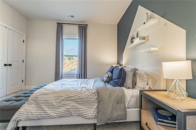 carpeted bedroom with a closet