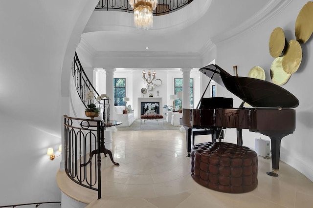 interior space featuring a notable chandelier, a raised ceiling, light tile floors, crown molding, and ornate columns