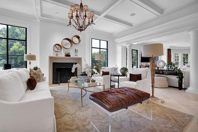 tiled living room with coffered ceiling, plenty of natural light, and ornate columns