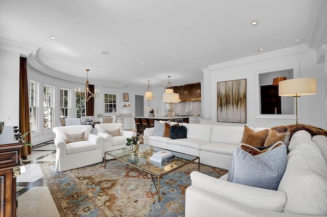 living room featuring light tile floors, ornamental molding, and a chandelier