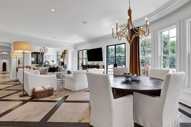 dining room with ornamental molding and a chandelier