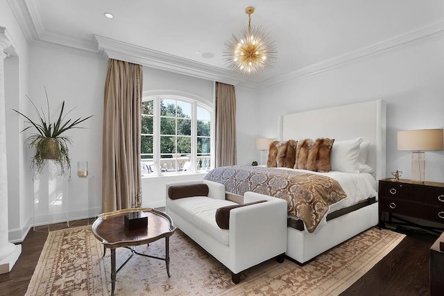 bedroom with a notable chandelier, ornamental molding, and dark hardwood / wood-style floors