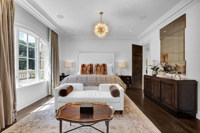 bedroom featuring dark hardwood / wood-style flooring, ornamental molding, and a chandelier