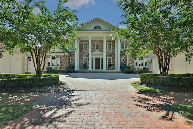 view of front facade featuring french doors and a garage