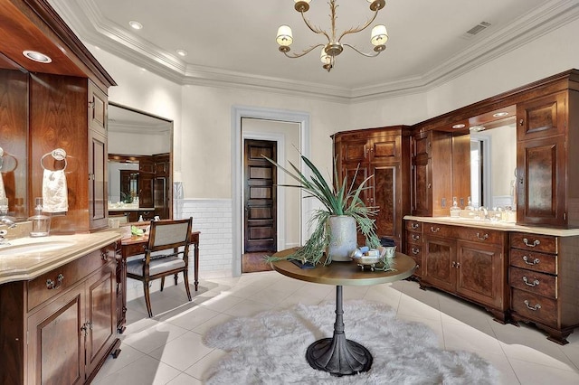 bathroom with a chandelier, tile flooring, ornamental molding, and dual vanity