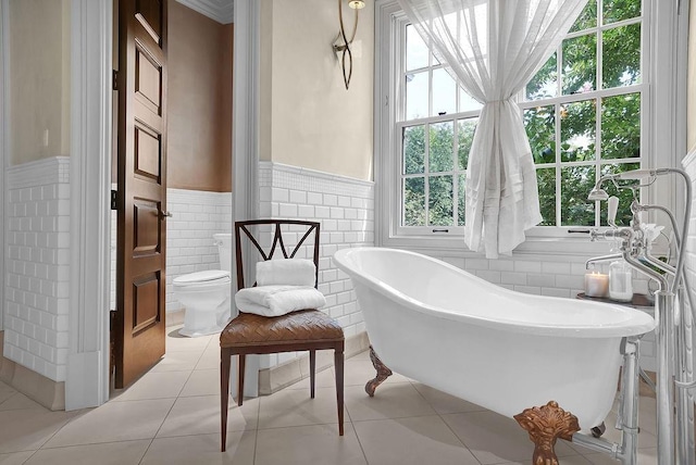 interior space featuring light tile flooring and tile walls