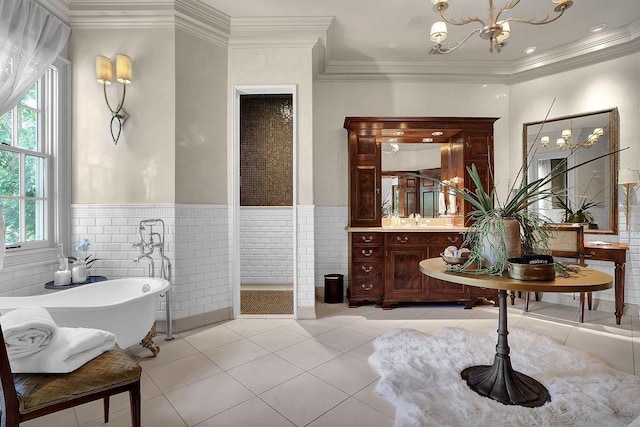 bathroom featuring tile walls, a washtub, tile flooring, a chandelier, and large vanity