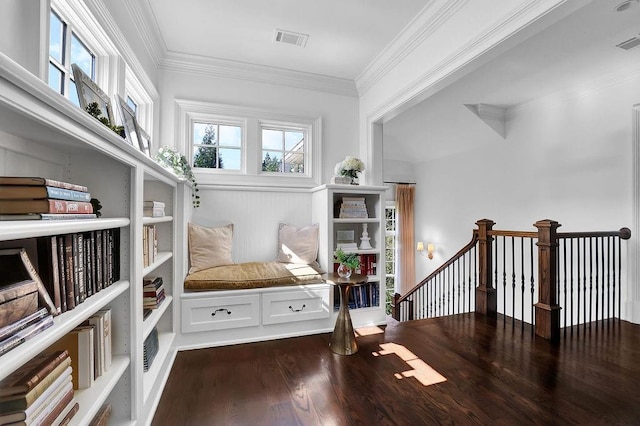 interior space featuring crown molding and dark wood-type flooring