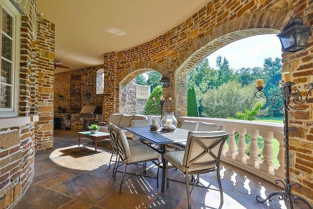 view of patio with ceiling fan and grilling area