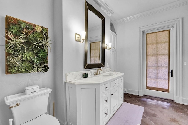 bathroom featuring oversized vanity, toilet, ornamental molding, and tile floors