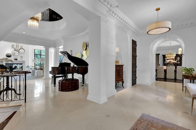 corridor with crown molding, decorative columns, a notable chandelier, and light tile floors