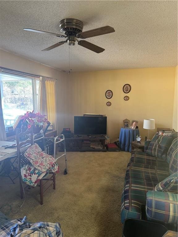 carpeted living room with ceiling fan and a textured ceiling