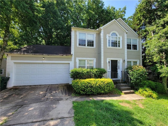 180 Preston Oaks Dr, Johns Creek, GA 30022 - view of front of property with driveway, a garage, and stucco siding