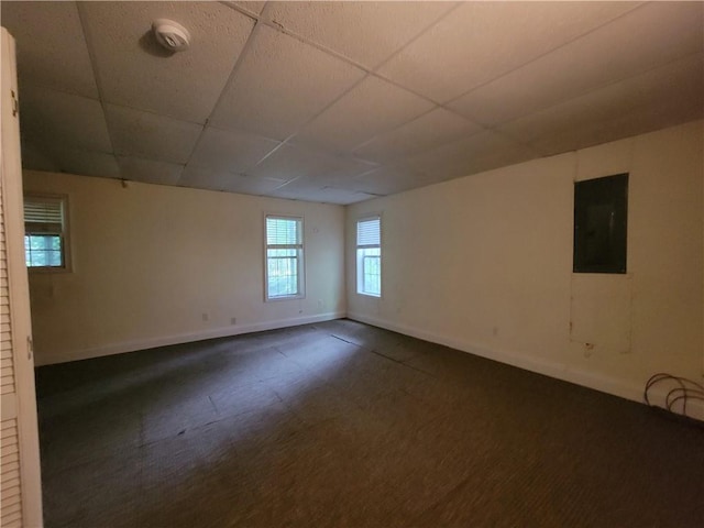 180 Preston Oaks Dr, Johns Creek, GA 30022 - unfurnished room with electric panel, a drop ceiling, dark colored carpet, and a smoke detector