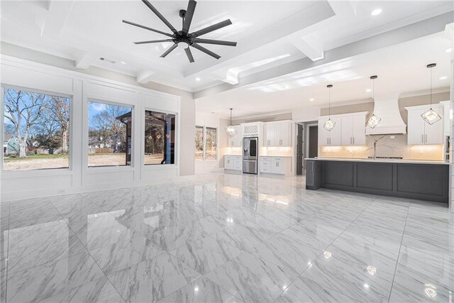 unfurnished living room with marble finish floor, ceiling fan, ornamental molding, and recessed lighting