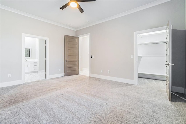 unfurnished bedroom with ornamental molding, carpet flooring, and baseboards